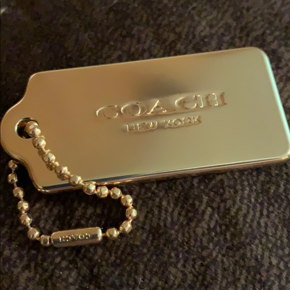 Coach gold tag